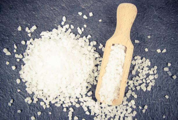 istock Coarse sea salt on dark background. Top view. 958446190
