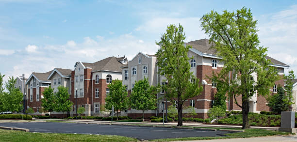 Upscale Red Brick & Tan Apartment Buildings Upscale red brick & tan apartment buildings for college student housing. college dorm photos stock pictures, royalty-free photos & images