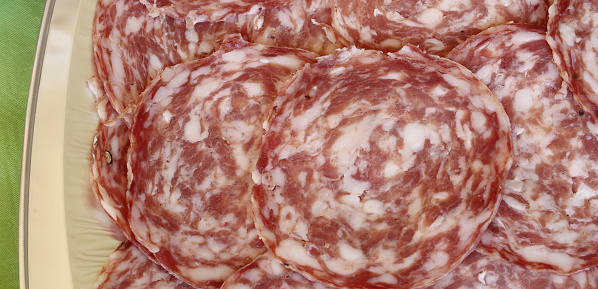cold cuts called sopressa in Italian Language on the tray