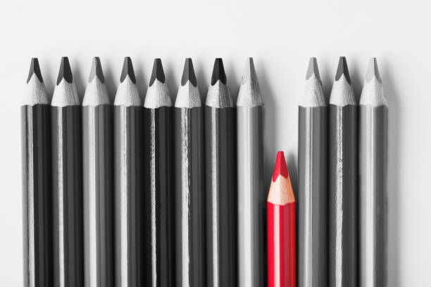 istock Red pencil among black and white. 958451604