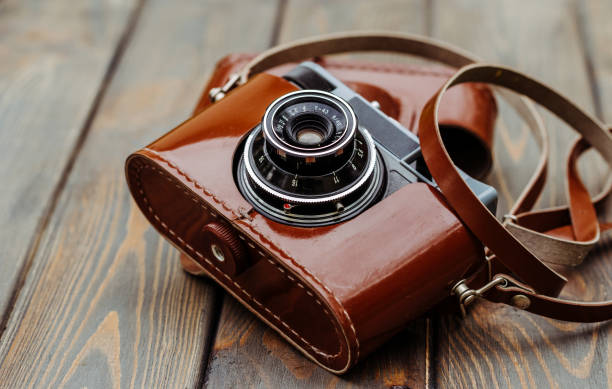 istock Old film camera in a brown leather case 958451610