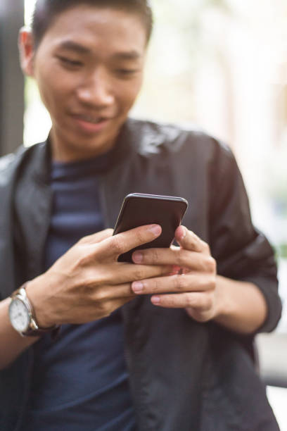 istock Man texting on the mobile phone 958458732