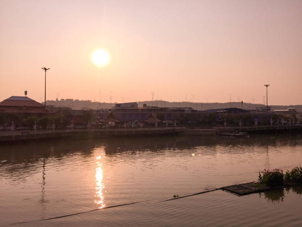 istock Sunset shadow vintage silhouetted orange sky on the river 958461036
