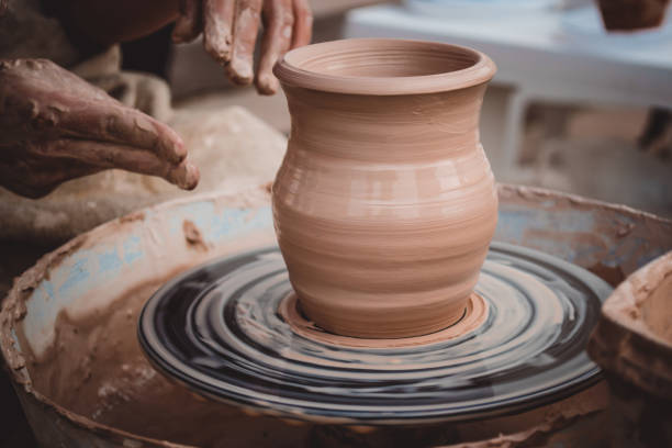 istock Master class on modeling of clay on a potter's wheel 958465050