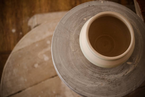 istock Clay pot on top of a potter's wheel 958465268