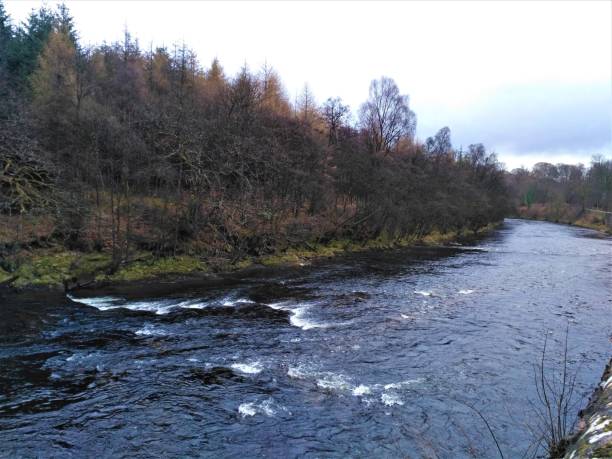 istock Nearly black river Teith close to the Whiskey distillery in Deanston 958465702