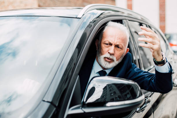 istock Angry senior man in business car 958469322