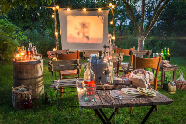 istock Open air cinema with retro projector in summer garden 958469824