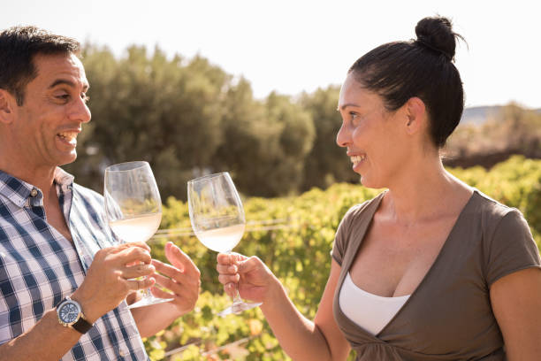 istock A man and woman drinking wine in a vineyard 958483484