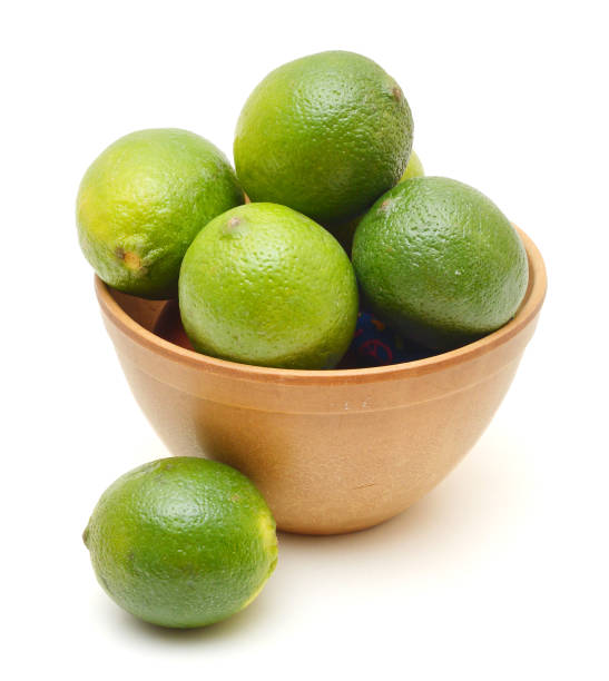 istock A green lemons on wooden bowl 958487168