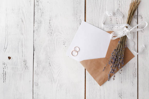 istock Wedding invitation card with envelope on wooden table 958487532
