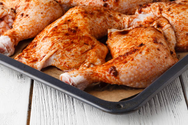 istock Raw chicken leg with spices ready to cooking 958487830
