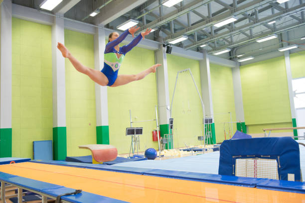 istock Young Athlete Exercising on Vaulting Trampoline 958491868