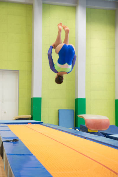 Young Athlete Performing Gymnastics Vault Young Athlete Performing Gymnastics Vault. trampoline backflip stock pictures, royalty-free photos & images