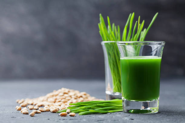 Natural wheat grass juice. Detox, diet and superfood. stock photo