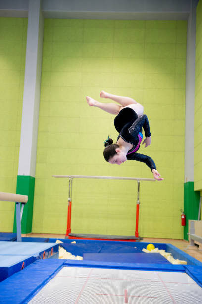 istock Young Girl Athlete Having Fun Practicing on Trampoline 958492446