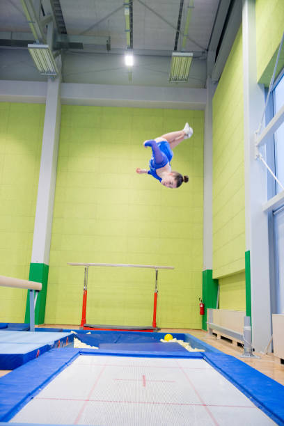 istock Young Girl Athlete Having Fun Practicing on Trampoline 958492466