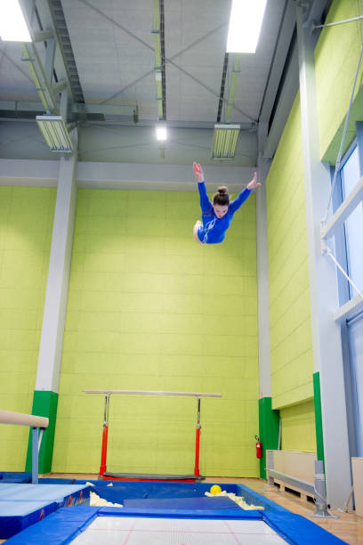 istock Young Girl Athlete Having Fun Practicing on Trampoline 958492468