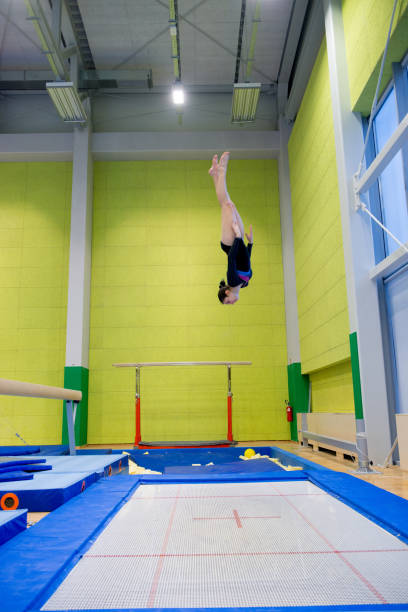 istock Late Teen Athlete Enjoying Trampoline Training 958492514