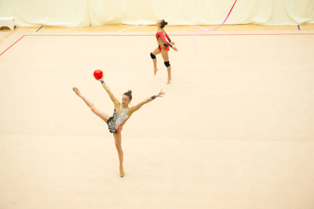istock Teenage Rhythmic Gymnastics Athletes Practicing 958496548
