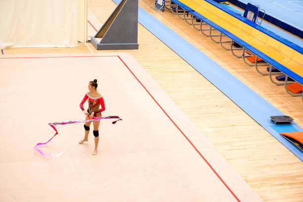 istock Late Teen Rhythmic Gymnastics Athlete Practicing with Ribbon 958496554