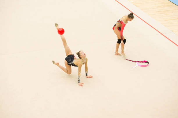 istock Teenage Rhythmic Gymnastics Athletes Practicing 958496556