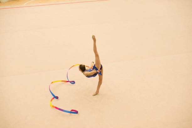 istock Teenage Rhythmic Gymnastics Athlete Practicing with Ribbon 958496608