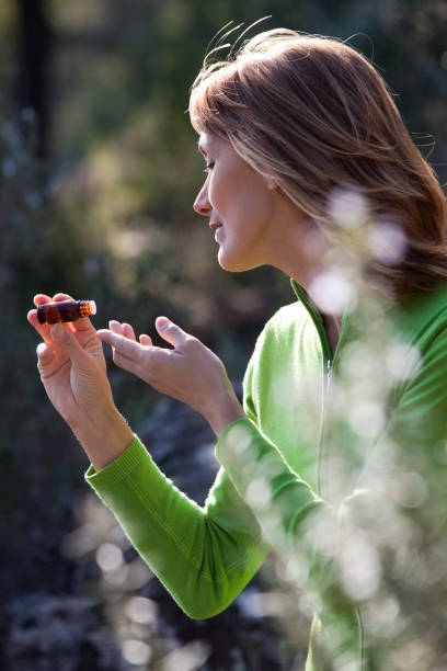 istock woman with essential oil 958497158
