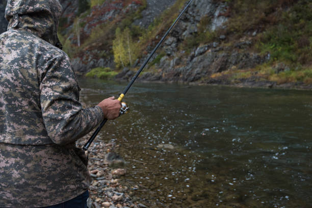 istock Fisherman at the Altai river 958497368