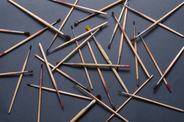 istock Paint  brushes on gray background. Accessories artist 958499684