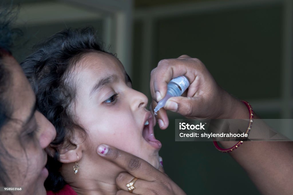 polio vaccine in india polio, vaccine, drops, India, baby girl Polio Stock Photo
