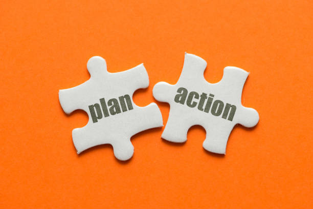 istock The word Plan Action on two matching puzzle on orange background 958503898