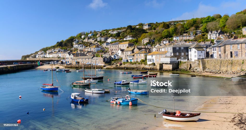 Mousehole Fishing Village Near Penzance in Cornwall, England Fishing Boats Moored in the Harbour Cornwall - England Stock Photo