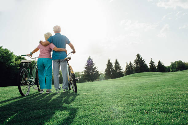 Mature couple outdoors with bicycles