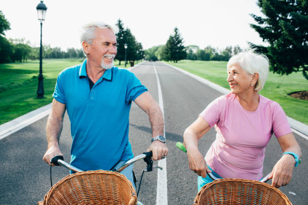 istock Senior couple riding bicycles 958510426