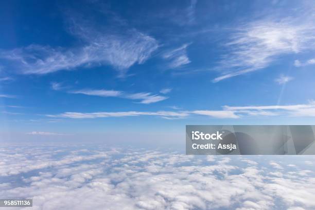 View From The Airplane To The Sky Above The Alps Mountains Blue Sky With Clouds Background Stock Photo - Download Image Now