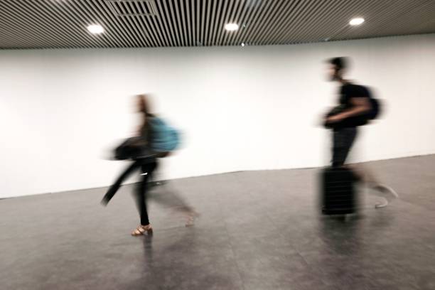 istock blurred people at the airport 958511674
