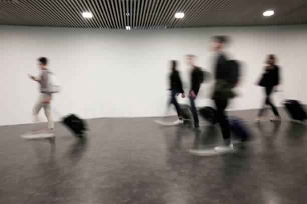 istock blurred people at the airport 958511682