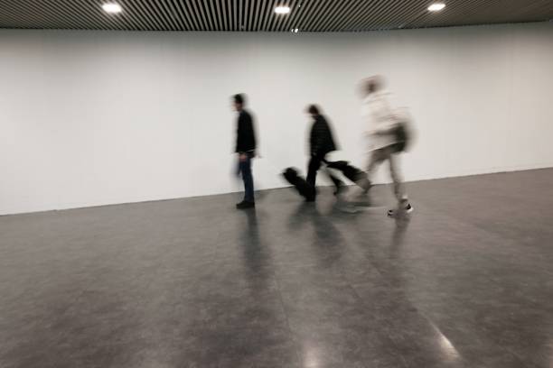 istock blurred people at the airport 958511690