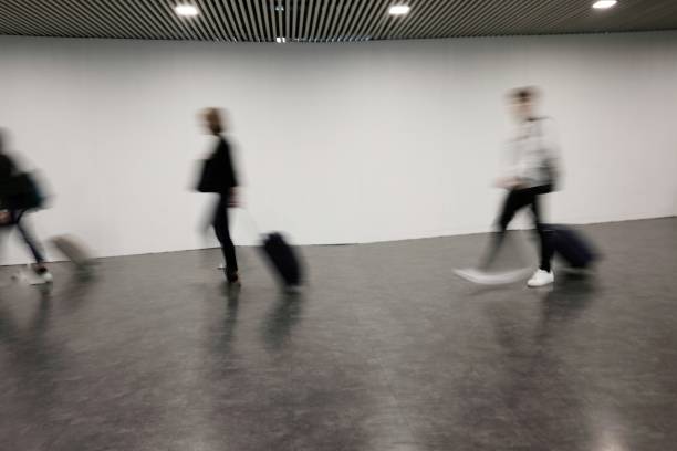 istock blurred people at the airport 958511700
