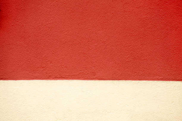 istock Close up of red and white painted concrete wall. 958518062