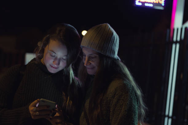 istock Friends with smartphone in the dark 958518174