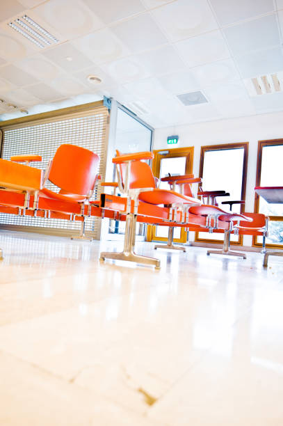 istock Empty Orange Seats At The Waiting Area 958519406