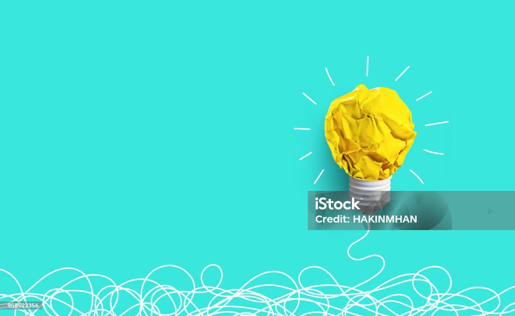 Creativity inspiration,ideas concepts with lightbulb from paper crumpled ball Creativity inspiration,ideas concepts with lightbulb from paper crumpled ball on pastel color background.Flat lay design. Ideas Stock Photo