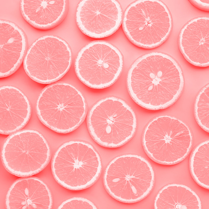 Group of orange slice in pink color.fruit and summer concept idea.flat lay design