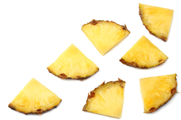 istock healthy background. pineapple slices isolated on white background top view 958529528