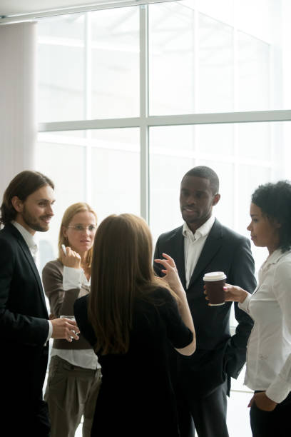 istock Executive business team having discussion at coffee break in office 958531518
