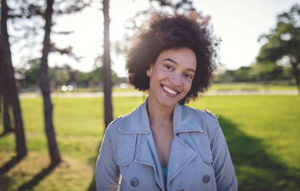 istock Gorgeous smiling woman with afro hair 958535462