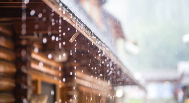 istock Downpour in the summer storm and rain drops on the roof 958539114