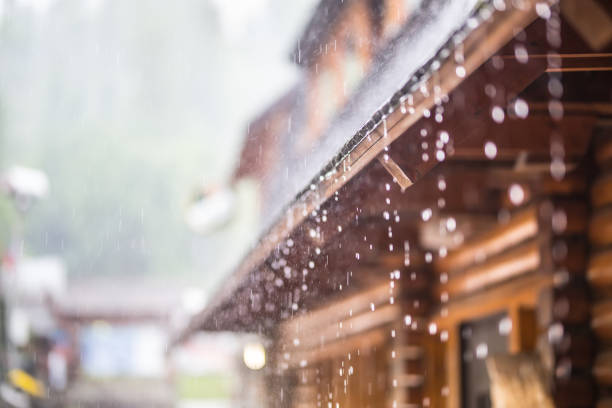 istock Downpour in the summer storm and rain drops on the roof 958539130